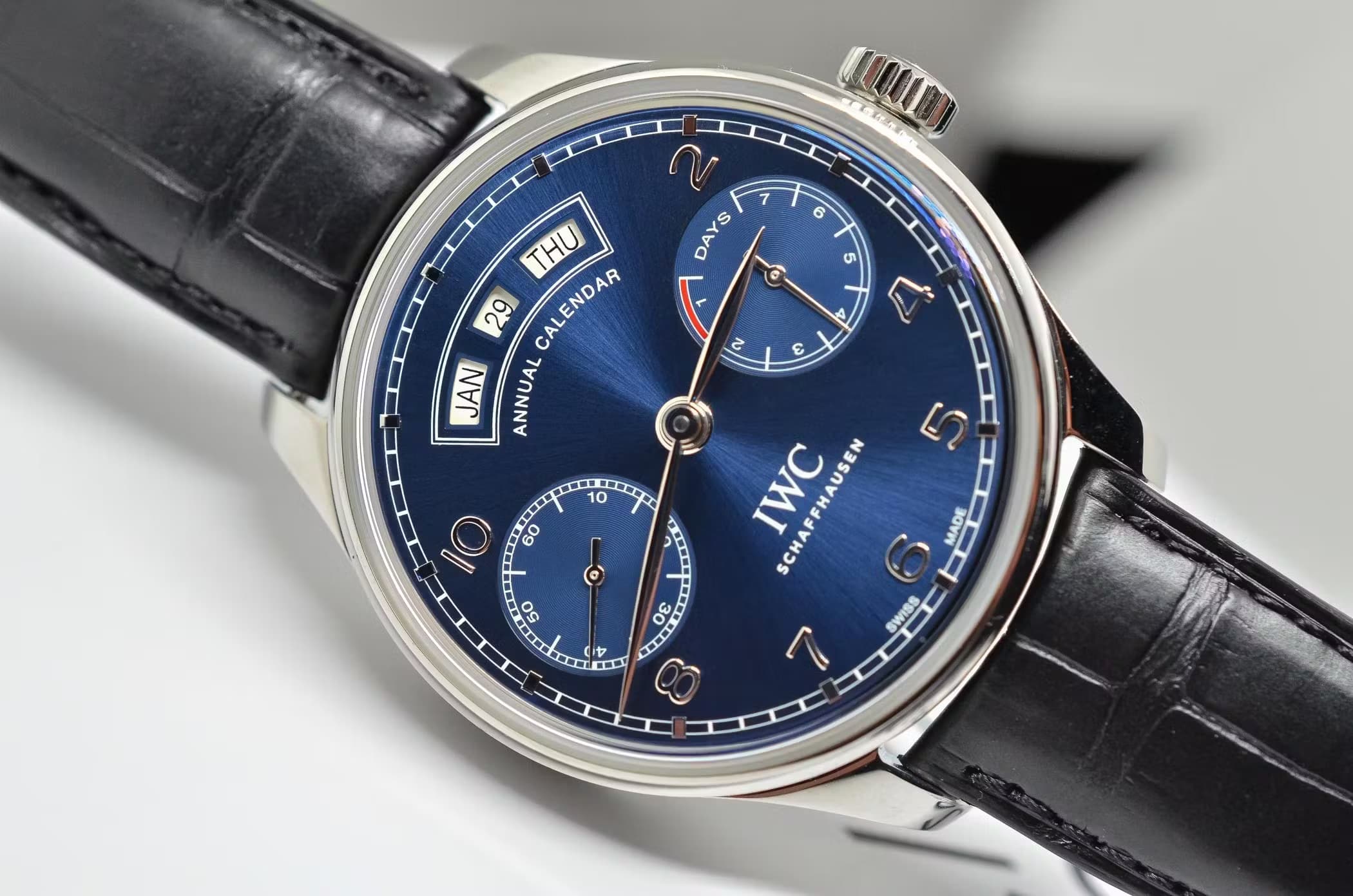 An IWC with a calendar complication that shows the Day, Date and Month, a very popular high-end calendar mechanism.