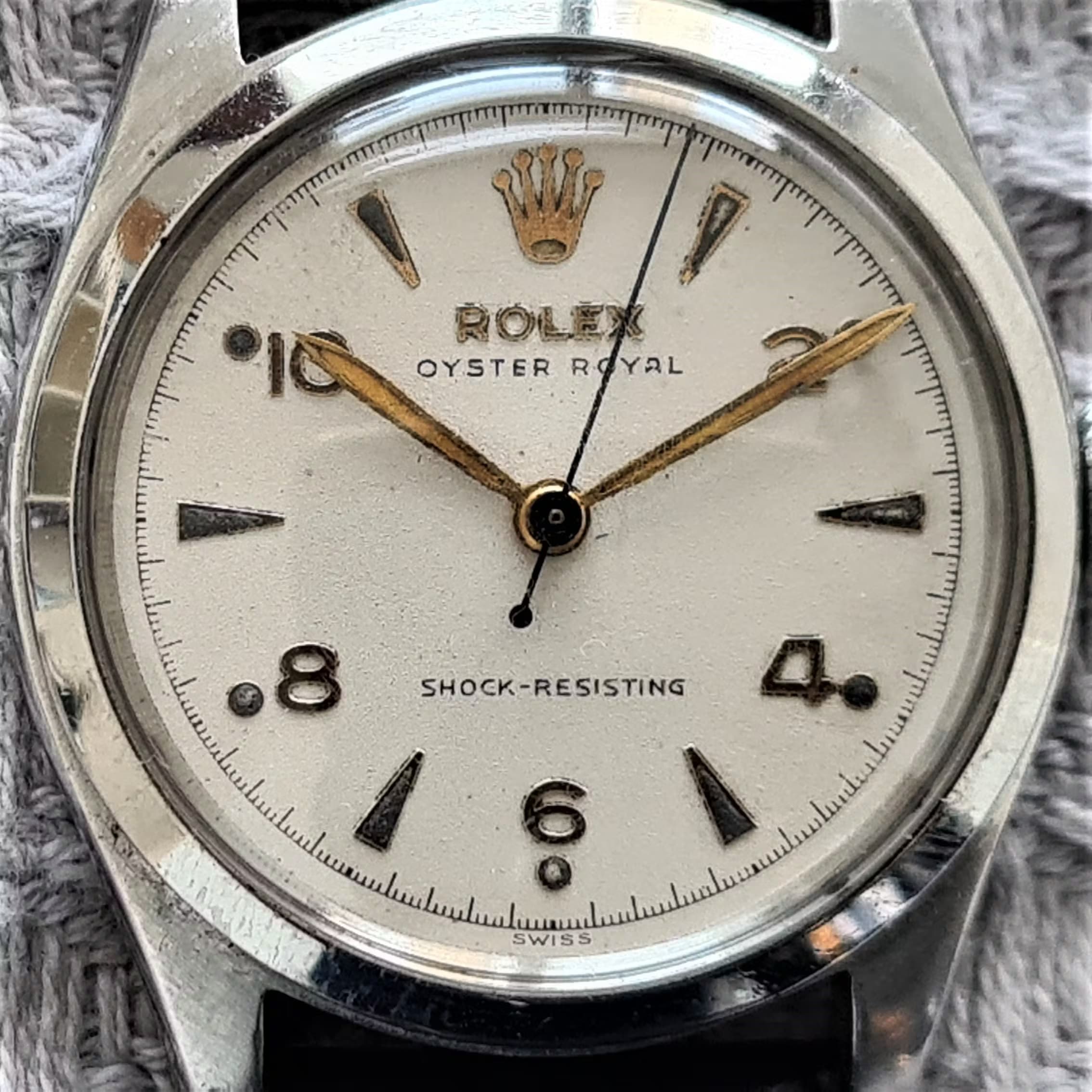 A vintage Rolex from the 1950s advertising its shock protection features on the dial.