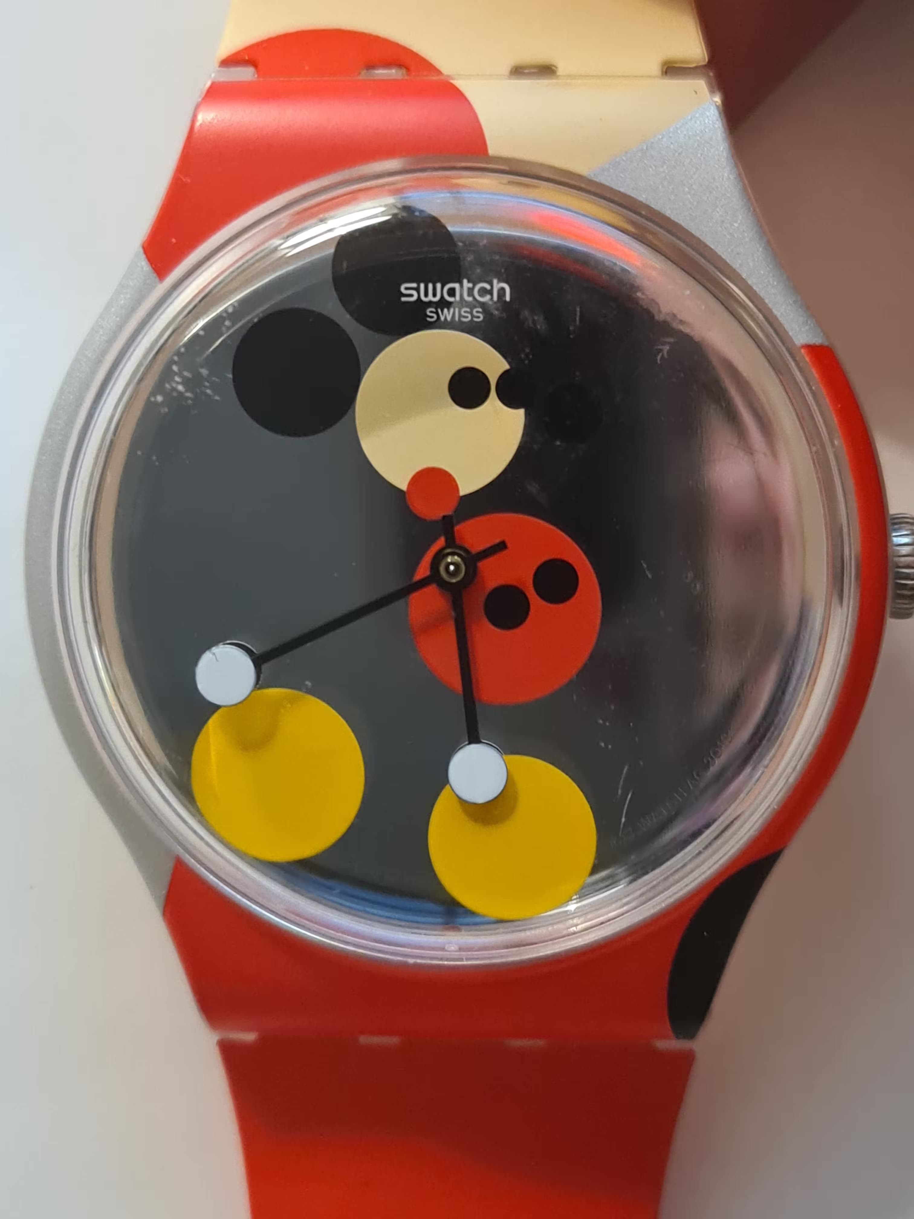 A Mickey Mouse Swatch made in collaboration with the artist Damien Hirst. This takes the iconic form of the cartoon character, the requirement of a simple swatch watch to have two hands, and the artistic style of Damien Hirst and translates all three into a fantastic design for a simple and unusual watch. The brand Swatch are famous for this approach.