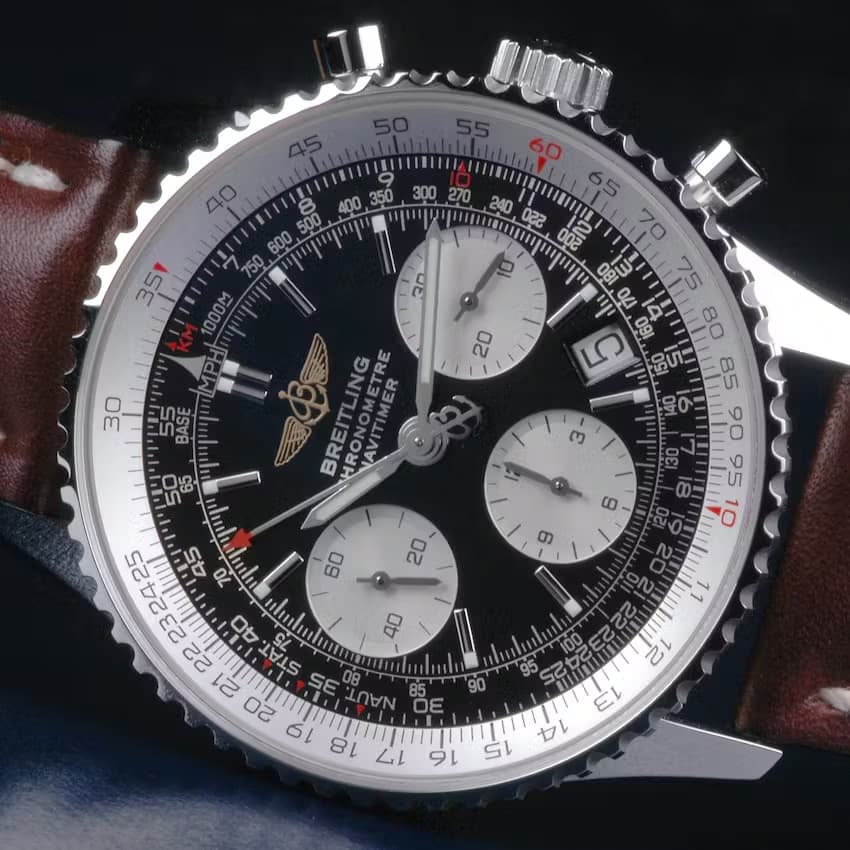 Breitling Navitimer with slide rule. The numbers printed on the black dial are fixed, and the wearer can rotate the numbers on the white bezel to perform calculations.