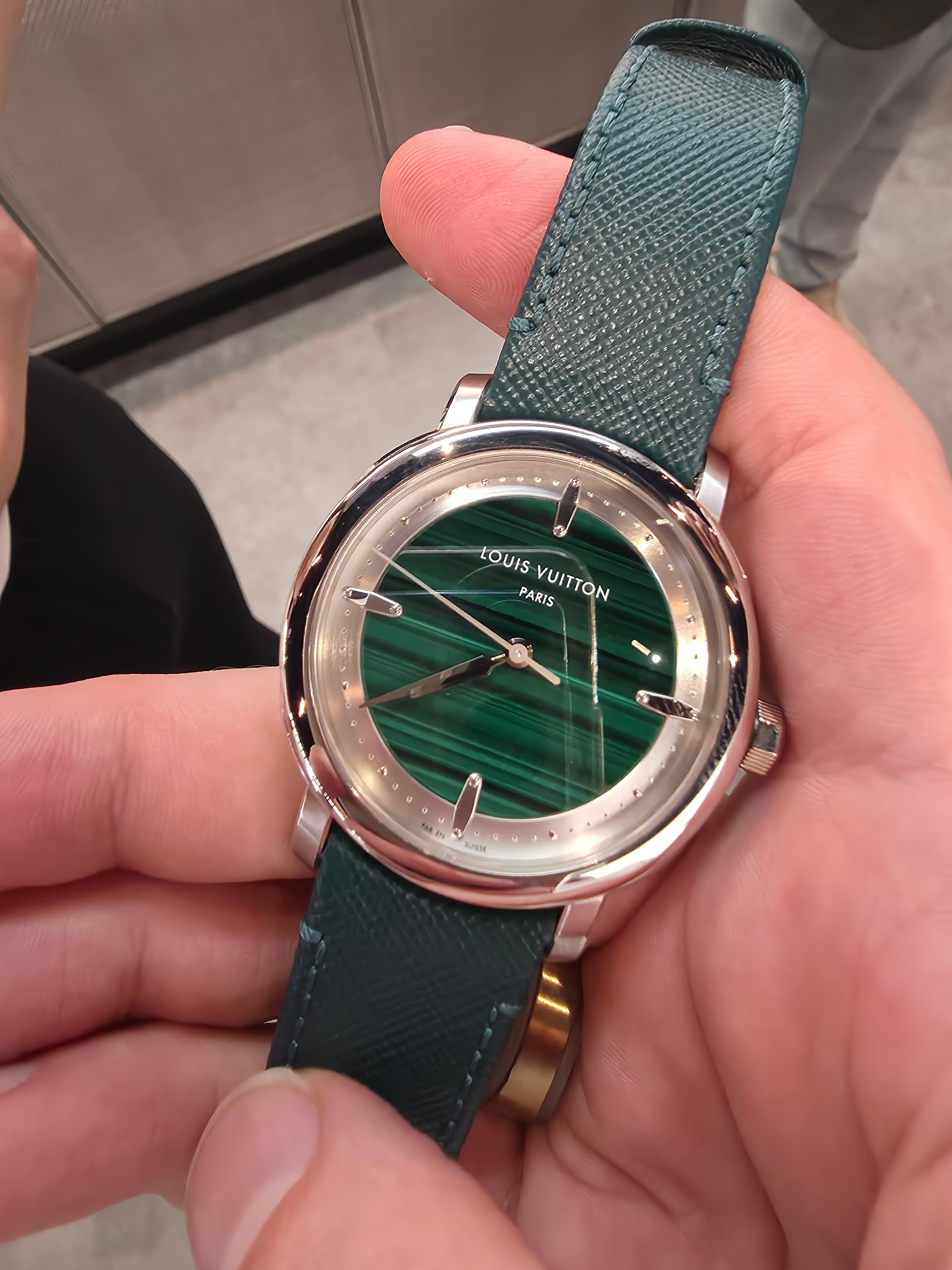 a green malachite dial Escale Louis Vuitton watch with platinum case and leather strap