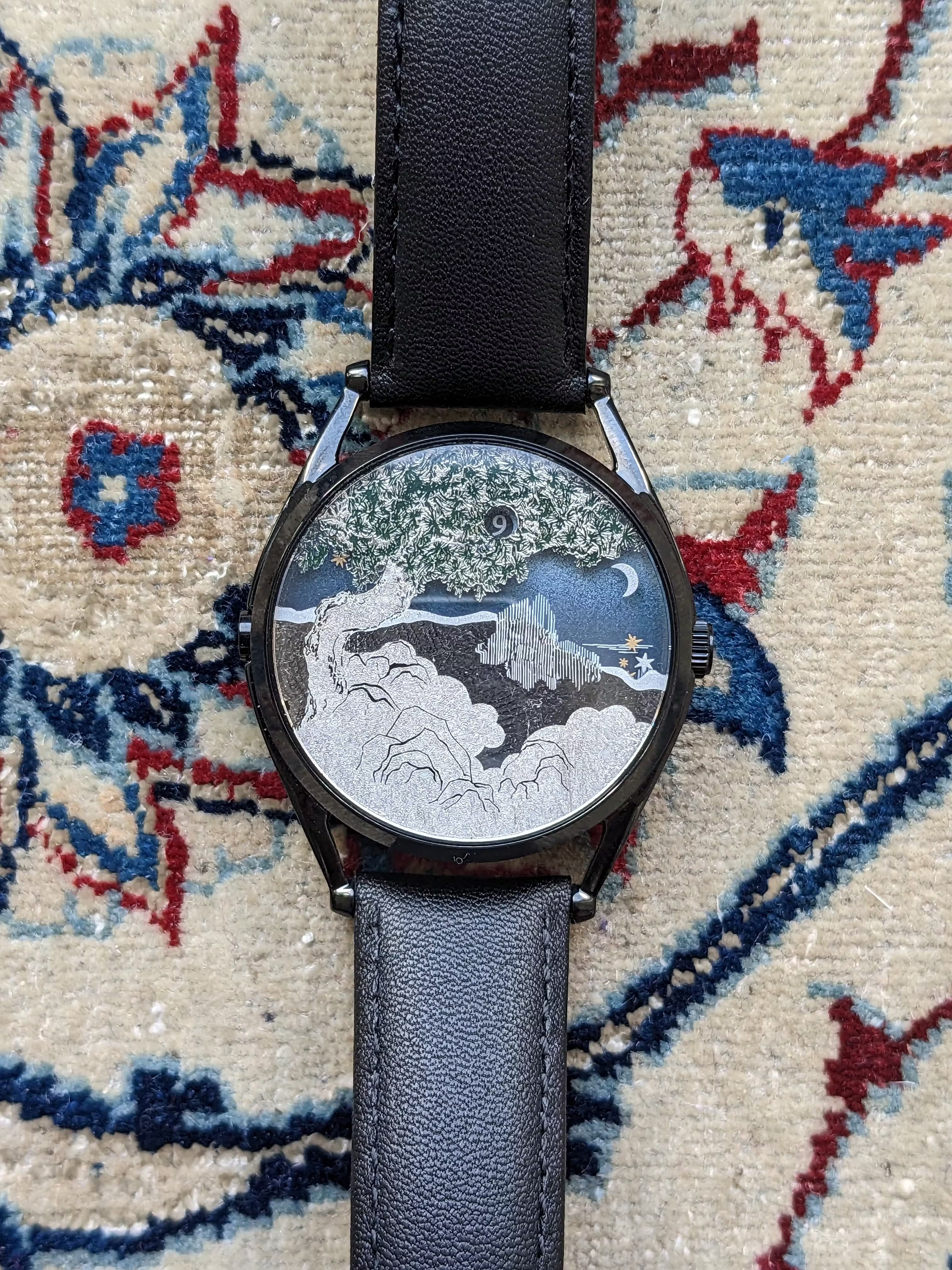 The Ascendant from Mr. Jones. The hour is in the small window in the tree branches and the minutes are calculated at the 3 o'clock position through a mix of small stars, with the crescent moon appearing at the top of the hour.